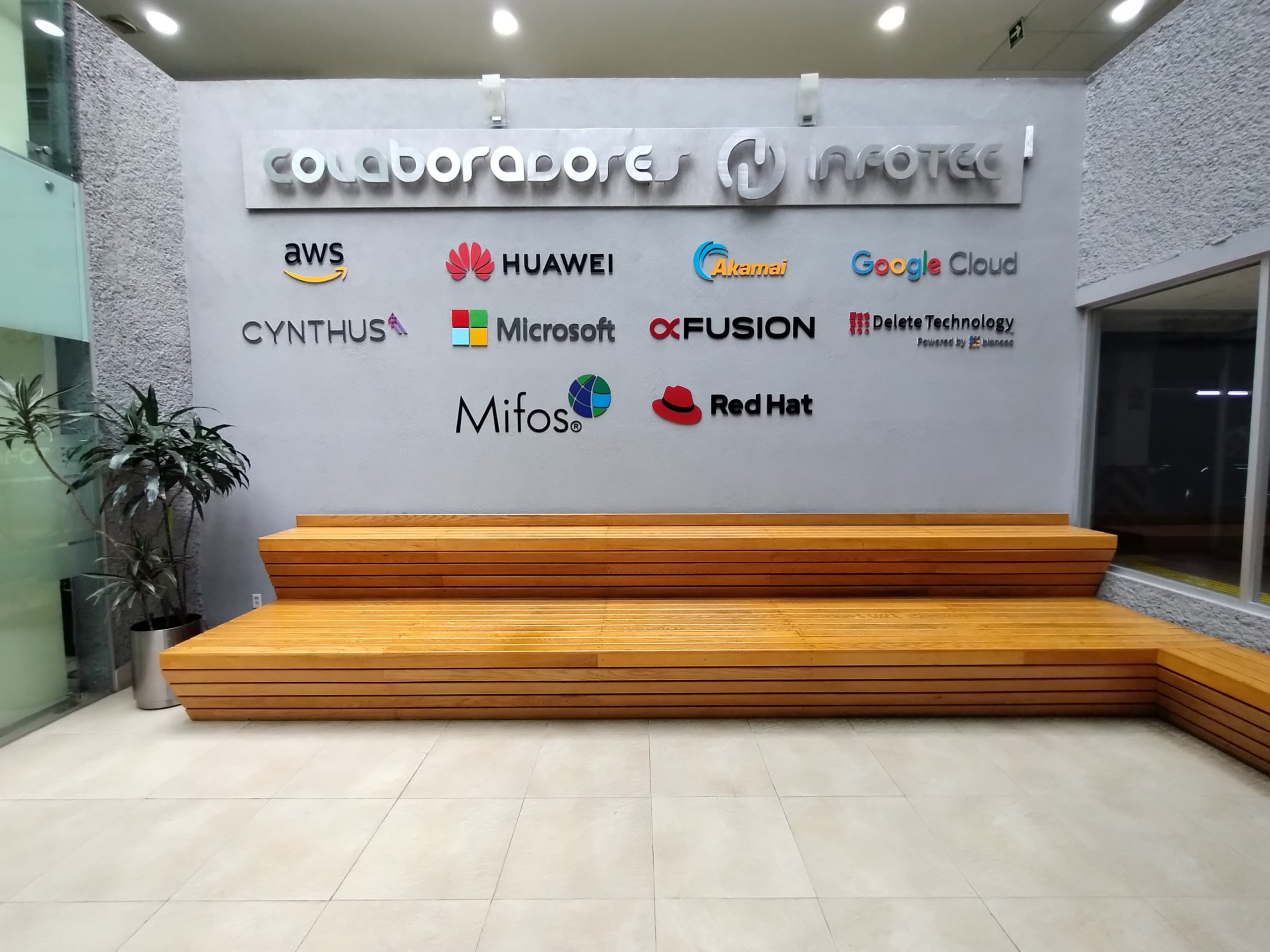 Mifos logo on Infotec wall of partners